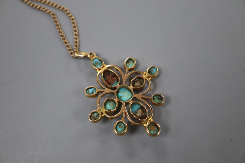An early 20th century yellow metal and turquoise set pendant, on a yellow metal chain, pendant 4cm, gross 10 grams.